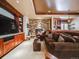 Relaxing basement lounge area with fireplace and bar at 8200 Harbortown Pl, Lone Tree, CO 80124