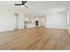 Open living room with hardwood floors and kitchen views at 42962 Colonial Trl, Elizabeth, CO 80107