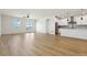 Spacious living room with light hardwood floors and access to a deck at 42962 Colonial Trl, Elizabeth, CO 80107