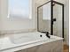Bathroom with soaking tub and walk-in shower at 42962 Colonial Trl, Elizabeth, CO 80107