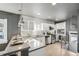 Modern kitchen with white cabinets, stainless steel appliances, and light flooring at 601 Jackson St, Denver, CO 80206