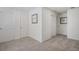 Spacious hallway with two doors and neutral wall colors at 27520 E Cedar Pl, Aurora, CO 80018