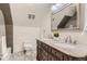 Bathroom with double vanity, granite countertop, and patterned floor at 500 Jackson St, Denver, CO 80206