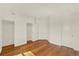 Bedroom with hardwood floors and multiple closets at 975 N Lincoln St # 10H, Denver, CO 80203