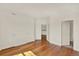 Spacious bedroom with hardwood floors and multiple closets and access to another room at 975 N Lincoln St # 10H, Denver, CO 80203