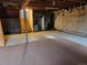 Unfinished basement with water heater and open space at 8025 S Cody St, Littleton, CO 80128