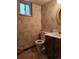 Basement bathroom with toilet, sink, and vanity at 8025 S Cody St, Littleton, CO 80128