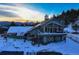 Two-story home with a large deck and mountain views at 5237 Bear Mountain Dr, Evergreen, CO 80439