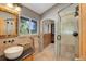Spa-like bathroom with walk-in shower and double vanity at 5237 Bear Mountain Dr, Evergreen, CO 80439