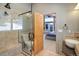 Bathroom features a walk-in shower and modern vanity at 5237 Bear Mountain Dr, Evergreen, CO 80439