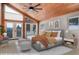 Virtually staged bedroom with mountain views at 5237 Bear Mountain Dr, Evergreen, CO 80439