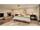 Basement bedroom with fireplace, hardwood floors, and ensuite bath at 5237 Bear Mountain Dr, Evergreen, CO 80439