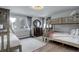 Bedroom with twin beds, dresser, and plenty of natural light at 5237 Bear Mountain Dr, Evergreen, CO 80439