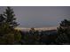 Stunning panoramic view of city lights at night at 5237 Bear Mountain Dr, Evergreen, CO 80439