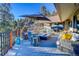 Spacious deck with seating area, fire pit, and mountain views at 5237 Bear Mountain Dr, Evergreen, CO 80439