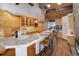 Gourmet kitchen featuring granite island and wood cabinets at 5237 Bear Mountain Dr, Evergreen, CO 80439