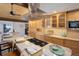 Modern kitchen with granite countertops and stainless steel appliances at 5237 Bear Mountain Dr, Evergreen, CO 80439