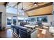 Spacious living room with vaulted ceiling and mountain views at 5237 Bear Mountain Dr, Evergreen, CO 80439