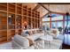 Virtually staged living room with built-in shelves and mountain views at 5237 Bear Mountain Dr, Evergreen, CO 80439
