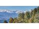Spectacular snow-capped mountain range view at 5237 Bear Mountain Dr, Evergreen, CO 80439