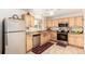 Kitchen with light wood cabinets, stainless steel appliances, and granite countertops at 12660 E Alaska Pl, Aurora, CO 80012