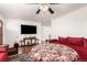 Living room with red couches, round table, and hardwood floors at 12660 E Alaska Pl, Aurora, CO 80012