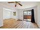 Bright living room with hardwood floors and access to a private patio at 1745 W 102Nd Ave, Thornton, CO 80260