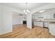 Bright kitchen features white cabinets, stainless steel appliances, and light countertops at 1745 W 102Nd Ave, Thornton, CO 80260