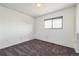 Simple bedroom with grey carpet, window, and neutral walls at 1745 W 102Nd Ave, Thornton, CO 80260