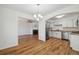 Bright kitchen features white cabinets, stainless steel appliances, and light countertops at 1745 W 102Nd Ave, Thornton, CO 80260