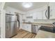 Clean and updated kitchen with stainless steel appliances and white cabinets at 1745 W 102Nd Ave, Thornton, CO 80260