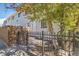 Townhouse exterior with small fenced yard and walkway at 1745 W 102Nd Ave, Thornton, CO 80260
