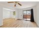 Hardwood floor living room with access to dining area and patio at 1745 W 102Nd Ave, Thornton, CO 80260