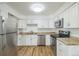 Updated kitchen with white cabinets and stainless steel appliances at 1745 W 102Nd Ave, Thornton, CO 80260