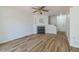 Living room features hardwood floors, a fireplace, and ceiling fan at 1745 W 102Nd Ave, Thornton, CO 80260