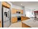 Stainless steel appliances and light wood cabinets in this kitchen at 2901 N Wyandot St # 7, Denver, CO 80211