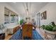 Bright dining room features a stylish wooden table, statement rug, and large windows at 4135 Perry St, Denver, CO 80212