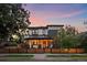 Two-story house with modern design and string lights at 4135 Perry St, Denver, CO 80212