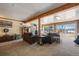 Bright basement Gathering room with large windows and comfortable seating at 3021 Pikes Peak Rd, Parker, CO 80138