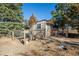 Chicken coop and run with surrounding trees at 3021 Pikes Peak Rd, Parker, CO 80138