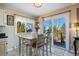 Charming dining area with sliding glass door leading to deck at 3021 Pikes Peak Rd, Parker, CO 80138