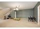 Finished basement game room with air hockey table and plenty of space for games at 1065 Independence Dr, Larkspur, CO 80118