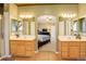 Spacious bathroom with double vanities and a view into the bedroom at 1065 Independence Dr, Larkspur, CO 80118
