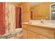 Clean bathroom with shower/tub combo and light wood vanity at 1065 Independence Dr, Larkspur, CO 80118