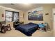 Basement bedroom with a mountain mural and comfortable sitting area at 1065 Independence Dr, Larkspur, CO 80118