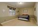 Cozy basement bedroom with a window overlooking the backyard at 1065 Independence Dr, Larkspur, CO 80118
