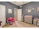 Bright bedroom with dresser, changing table, and ample closet space at 1065 Independence Dr, Larkspur, CO 80118