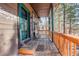 Wooden front porch with green accents at 1065 Independence Dr, Larkspur, CO 80118