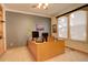 Bright home office with built-in shelves and large windows at 1065 Independence Dr, Larkspur, CO 80118