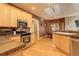 Bright kitchen boasts ample cabinetry, granite counters, and a breakfast nook at 1065 Independence Dr, Larkspur, CO 80118